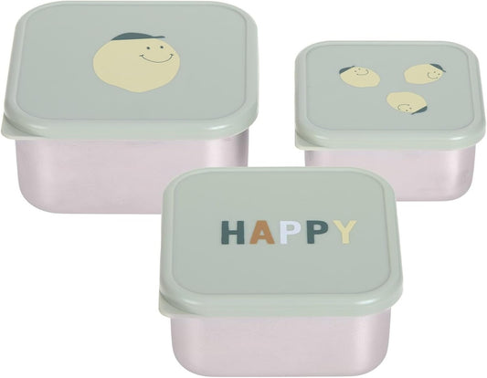 Trzy pojemniki z jasnymi pokrywkami; na pokrywkach widoczne buźki i napis HAPPY.